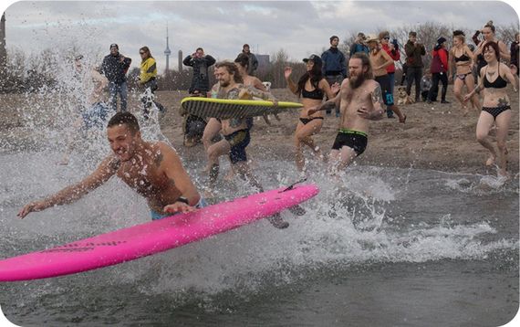 Brainfreeze participants jumping into the freezing cold lake