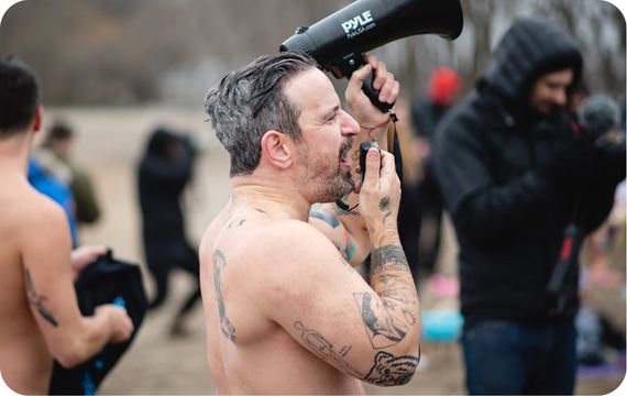 Jesse Hayman encouraging participants with megaphone in hand